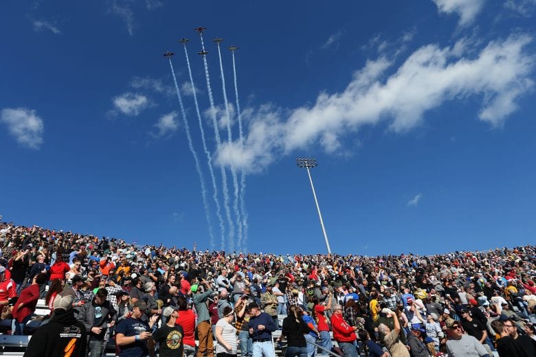 MARTINSVILLE, VA - OCTOBER 28: Fans look on as a flyover is performed during pre-race ceremonies prior to the Monster Energy NASCAR Cup Series First Data 500 at Martinsville Speedway on October 28, 2018 in Martinsville, Virginia. (Photo by Brian Lawdermilk/Getty Images) | Getty Images