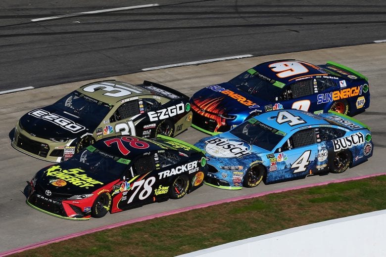 MARTINSVILLE, VA - OCTOBER 28:  Martin Truex Jr., driver of the #78 5-hour ENERGY/Bass Pro Shops Toyota, and Ryan Newman, driver of the #31 E-Z-GO Chevrolet, lead Kevin Harvick, driver of the #4 Busch Beer Ford, and Chase Elliott, driver of the #9 SunEnergy1 Chevrolet, during the Monster Energy NASCAR Cup Series First Data 500 at Martinsville Speedway on October 28, 2018 in Martinsville, Virginia.  (Photo by Sarah Crabill/Getty Images) | Getty Images