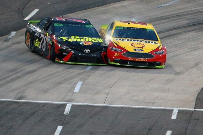 MARTINSVILLE, VA - OCTOBER 28:  Martin Truex Jr., driver of the #78 5-hour ENERGY/Bass Pro Shops Toyota, and Joey Logano, driver of the #22 Shell Pennzoil Ford, race out of turn four on the final lap during the Monster Energy NASCAR Cup Series First Data 500 at Martinsville Speedway on October 28, 2018 in Martinsville, Virginia.  (Photo by Sean Gardner/Getty Images) | Getty Images