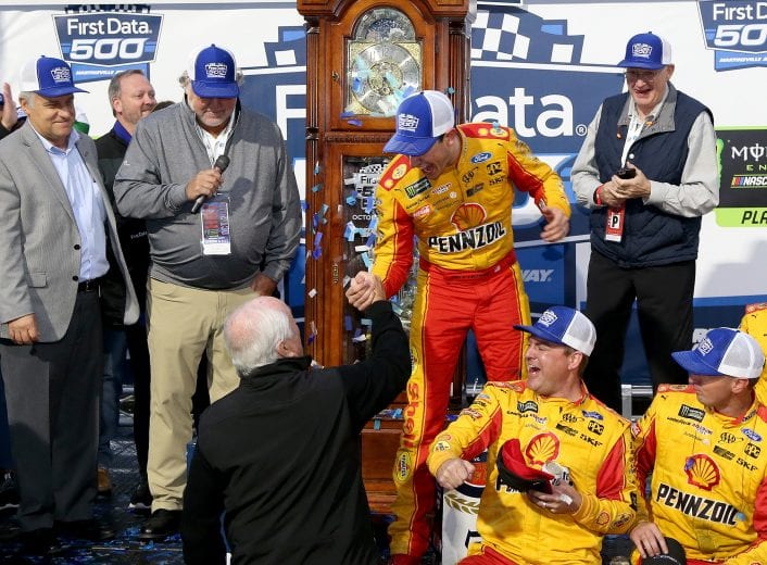 MARTINSVILLE, VA - OCTOBER 28:  Team owner Roger Penske congratulates Joey Logano, driver of the #22 Shell Pennzoil Ford, after winning the Monster Energy NASCAR Cup Series First Data 500 at Martinsville Speedway on October 28, 2018 in Martinsville, Virginia.  (Photo by Brian Lawdermilk/Getty Images) | Getty Images