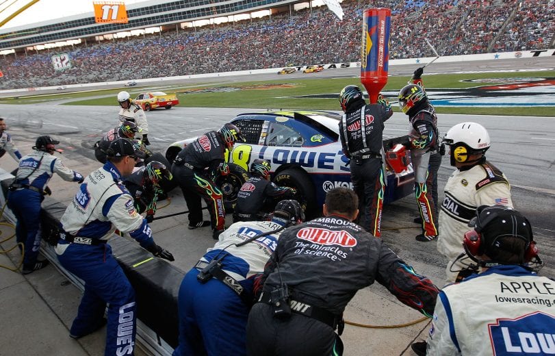 FORT WORTH, TX - NOVEMBER 07:  Crew members of the #24 DuPont/National Guard Chevrolet pit the #48 Lowe's Chevrolet, driven by Jimmie Johnson, during the NASCAR Sprint Cup Series AAA Texas 500 at Texas Motor Speedway on November 7, 2010 in Fort Worth, Texas.  (Photo by Tom Pennington/Getty Images for NASCAR) | Getty Images