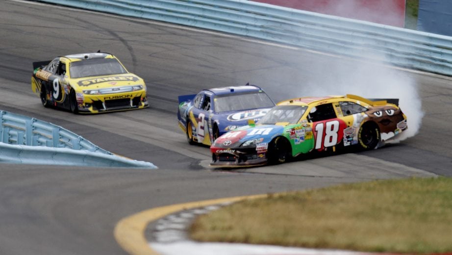 WATKINS GLEN, NY - AUGUST 12: Kyle Busch, driver of the #18 M&M's Toyota, is involved in an incident ahead of Brad Keselowski, driver of the #2 Miller Lite Dodge, and Marcos Ambrose, driver of the #9 Stanley Ford, during the NASCAR Sprint Cup Series Finger Lakes 355 at the Glen at Watkins Glen International on August 12, 2012 in Watkins Glen, New York. (Photo by Jerry Markland/Getty Images for NASCAR) | Getty Images