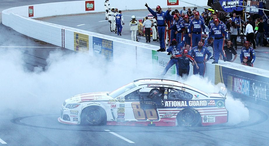 Dale Earnhardt Jr. celebrates with a burnout after winning at Martinsville in 2014.