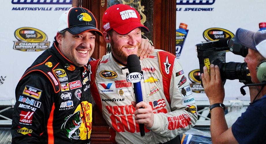 Dale Earnhardt Jr. shares a lighthearted moment with Tony Stewart while Earnhardt conducted a TV interview after winning at Martinsville in 2014.
