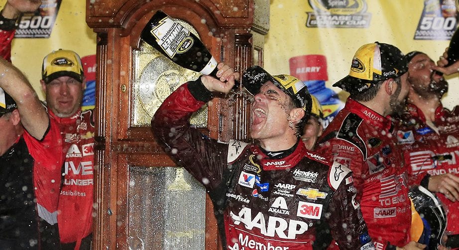 Jeff Gordon douses himself with champagne after winning at Martinsville in 2015.