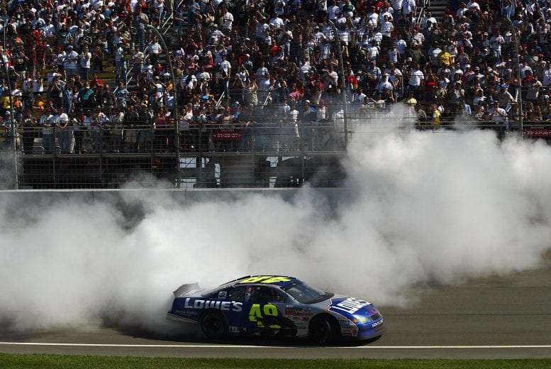 28 Apr 2002:  Jimmie Johnson, driver of the #48 Gordon Racing Lowe's Chevrolet Monte Carlo, celebrates his victory in the NAPA Auto Parts 500, part of the Nascar Winston Cup Series, at California Speedway in Fontana, California. DIGITAL IMAGE. Mandatory Credit: Donald Miralle/Getty Images | Getty Images