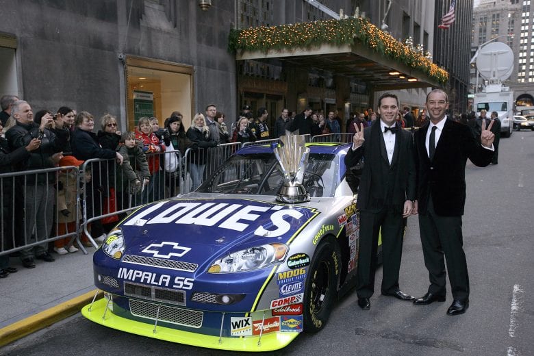 NEW YORK - NOVEMBER 30:  Jimmie Johnson (L), the 2007 NASCAR Nextel Cup Champion, and his crew chief, Chad Knaus pose next to the #48 Lowe's Chevrolet and the NASCAR Nextel Cup Trophy prior to the NASCAR Nextel Cup Series Awards Ceremony outside the Waldorf Astoria on November 30, 2007 in New York City.  (Photo by Chris Trotman/Getty Images for NASCAR) | Getty Images