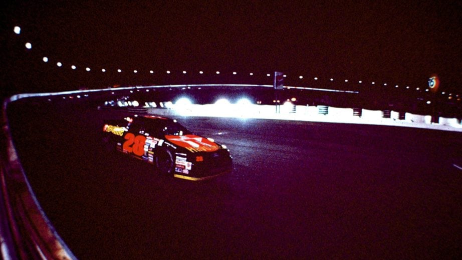 CHARLOTTE, NC - MAY 16, 1992: Davey Allison, Kyle Petty and Dale Earnhardt wage a torrid duel on the final lap of the 1992 All Star race at Charlotte. Allison dives under Petty for the win at the finish line as the two touch. Allison is sent into the wall and goes to the hospital instead of victory lane. (Photo by ISC Archives via Getty Images)