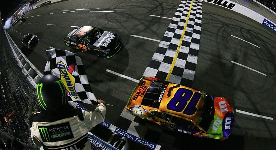 Kyle Busch crosses the finish line ahead of Martin Truex Jr. to win at Martinsville in 2017.