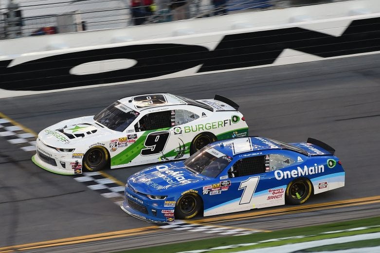 DAYTONA BEACH, FL - FEBRUARY 17:  Tyler Reddick, driver of the #9 BurgerFi Chevrolet, crosses the finish line in front of Elliott Sadler, driver of the #1 OneMain Financial Chevrolet, to win the NASCAR Xfinity Series PowerShares QQQ 300 at Daytona International Speedway on February 17, 2018 in Daytona Beach, Florida.  (Photo by Jared C. Tilton/Getty Images) | Getty Images