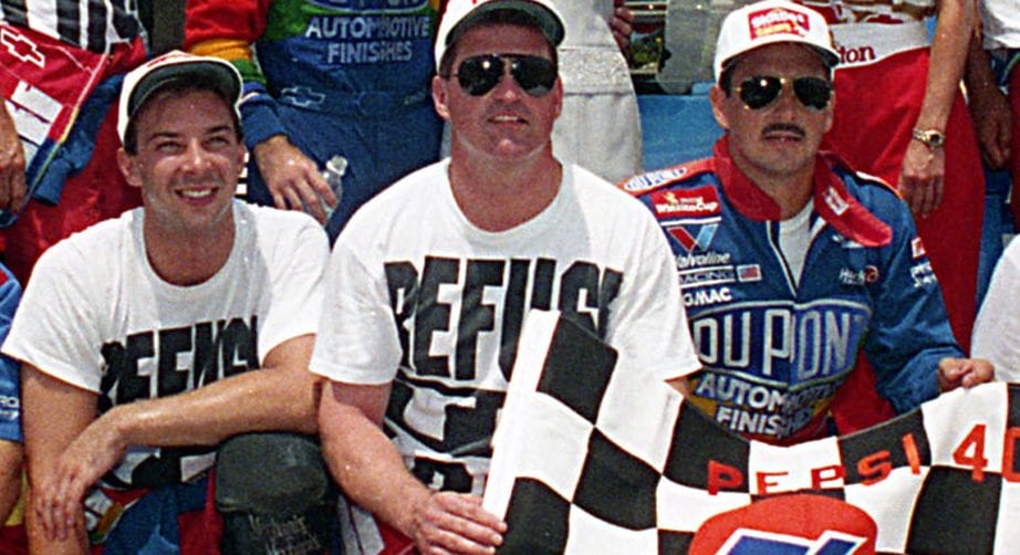 Jeff Gordon won the Pepsi 400 at Daytona International Speedway in 1995. His team wore their “Refuse to Lose” T-shirts in Victory Lane, including tire changer Chad Knaus, left.
