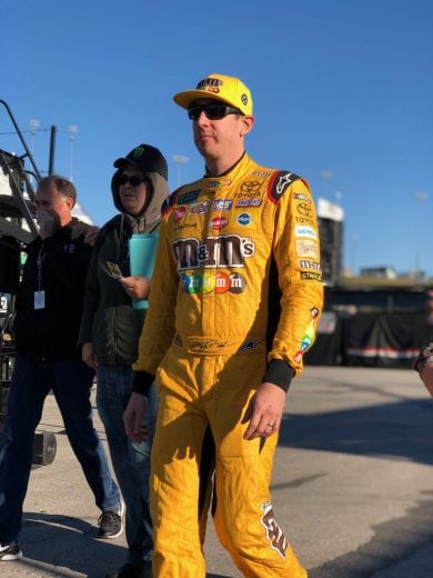 Kyle Busch walks through the garage at Kansas.