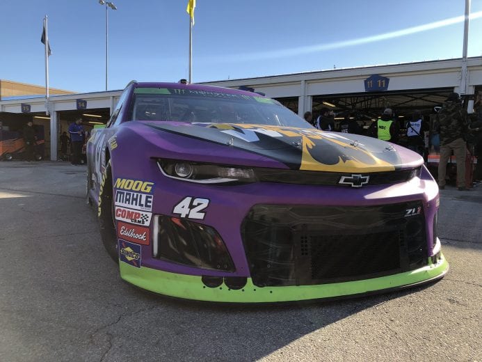 Kyle Larson backs out of the garage to go practice at Kansas.