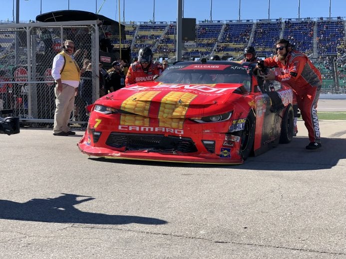 Justin Allgaier's wrecked car is taken back to the garage at Kansas.