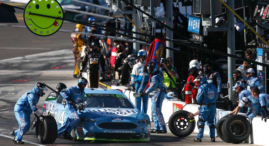 Kevin Harvick's pit crew goes to work during a stop in Phoenix.