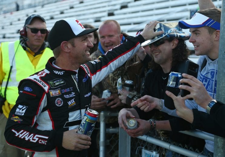 MARTINSVILLE, VA - MARCH 26:  Clint Bowyer, driver of the #14 Haas Automation Demo Day Ford, celebrates with the fans after winning the weather delayed Monster Energy NASCAR Cup Series STP 500 at Martinsville Speedway on March 26, 2018 in Martinsville, Virginia.  (Photo by Sarah Crabill/Getty Images) | Getty Images