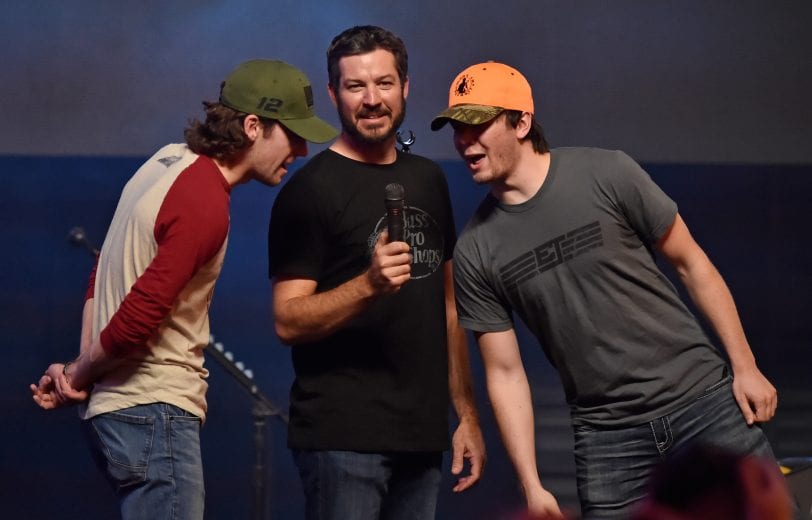 LAS VEGAS, NV - SEPTEMBER 15: (L-R) Ryan Blaney, driver of the #12 BODYARMOR Ford, Martin Truex Jr., driver of the #78 Auto-Owners Insurance Toyota and Erik Jones, driver of the #20 buyatoyota.com Toyota speak at the Monster Energy NASCAR Cup Series Experience during the NASCAR Playoffs Party at the Fremont Street Experience on September 15, 2018 in Las Vegas, Nevada. (Photo by David Becker/Getty Images) | Getty Images