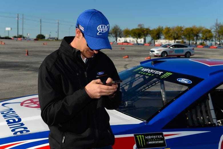 FORT WORTH, TX - NOVEMBER 02: Joey Logano, driver of the #22 AAA Insurance Ford, sends a text message at the AAA InTEXTicated distracted driving event prior to practice for the Monster Energy NASCAR Cup Series AAA Texas 500 at Texas Motor Speedway on November 2, 2018 in Fort Worth, Texas. (Photo by Robert Laberge/Getty Images) | Getty Images