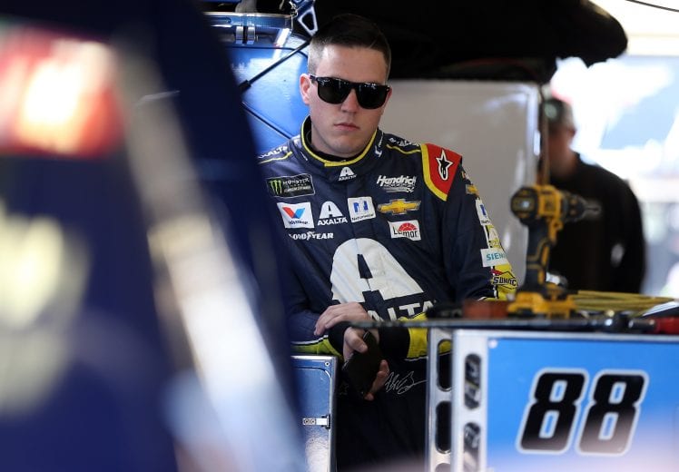 FORT WORTH, TX - NOVEMBER 02: Alex Bowman, driver of the #88 Axalta Chevrolet, stands in the garage area during practice for the Monster Energy NASCAR Cup Series AAA Texas 500 at Texas Motor Speedway on November 2, 2018 in Fort Worth, Texas. (Photo by Matt Sullivan/Getty Images) | Getty Images