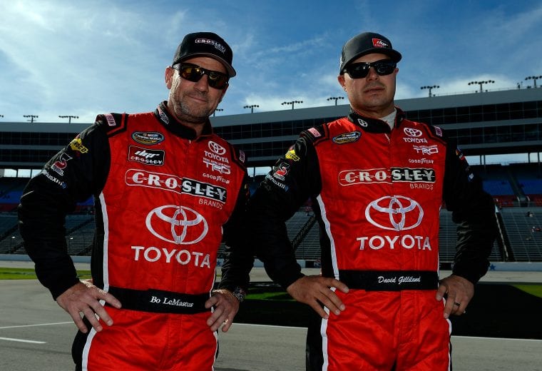 FORT WORTH, TX - NOVEMBER 02: Bo LeMastus(L), driver of the #54 Crosley Brands/DGR-CROSLEY Toyota, and David Gilliland, driver of the #17 CrslyBrnds/FrntlneEntrprss/DGR-CROSLEY Toyota, stand on the grid during qualifying for the NASCAR Camping World Truck Series JAG Metals 350 at Texas Motor Speedway on November 2, 2018 in Fort Worth, Texas. (Photo by Robert Laberge/Getty Images) | Getty Images
