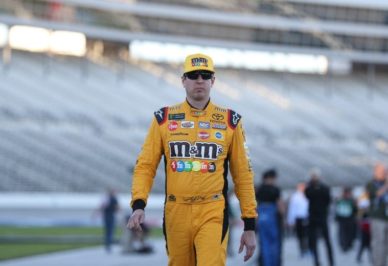 FORT WORTH, TX - NOVEMBER 02: Kyle Busch, driver of the #18 M&M's Toyota, stands on the grid during qualifying for the Monster Energy NASCAR Cup Series AAA Texas 500 at Texas Motor Speedway on November 2, 2018 in Fort Worth, Texas. (Photo by Matt Sullivan/Getty Images) | Getty Images