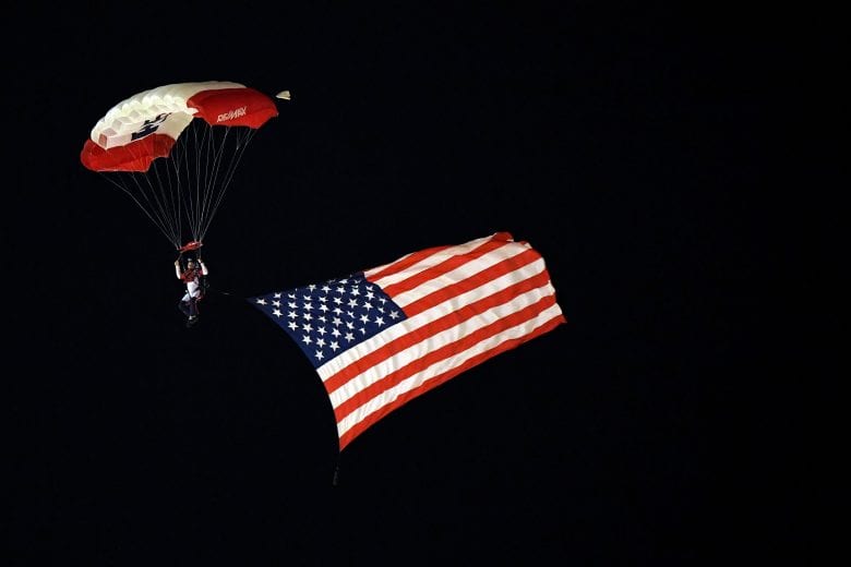 FORT WORTH, TX - NOVEMBER 02: A skydiver flies with the American flag prior to the NASCAR Camping World Truck Series JAG Metals 350 at Texas Motor Speedway on November 2, 2018 in Fort Worth, Texas. (Photo by Josh Hedges/Getty Images) | Getty Images