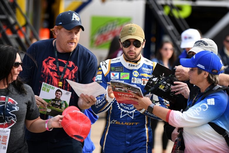 FORT WORTH, TX - NOVEMBER 03: Chase Elliott, driver of the #9 Kelley Blue Book Chevrolet, signs autographs in the garage area during practice for the Monster Energy NASCAR Cup Series AAA Texas 500 at Texas Motor Speedway on November 3, 2018 in Fort Worth, Texas. (Photo by Josh Hedges/Getty Images) | Getty Images