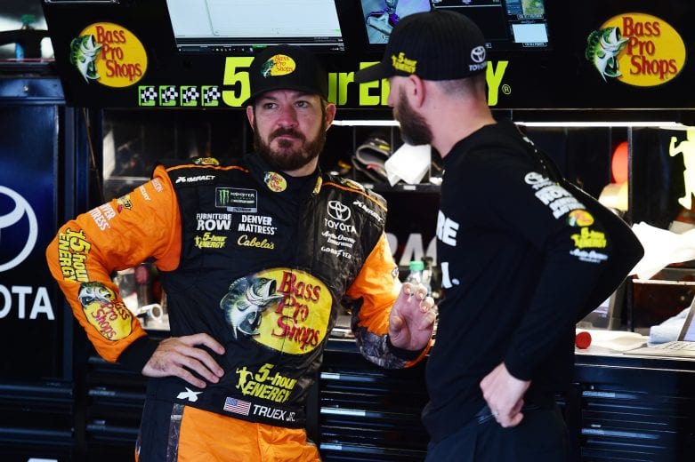 FORT WORTH, TX - NOVEMBER 03: Martin Truex Jr., driver of the #78 Bass Pro Shops/5-hour ENERGY Toyota, talks with crew chief Cole Pearn in the garage area during practice for the Monster Energy NASCAR Cup Series AAA Texas 500 at Texas Motor Speedway on November 3, 2018 in Fort Worth, Texas. (Photo by Jared C. Tilton/Getty Images) | Getty Images