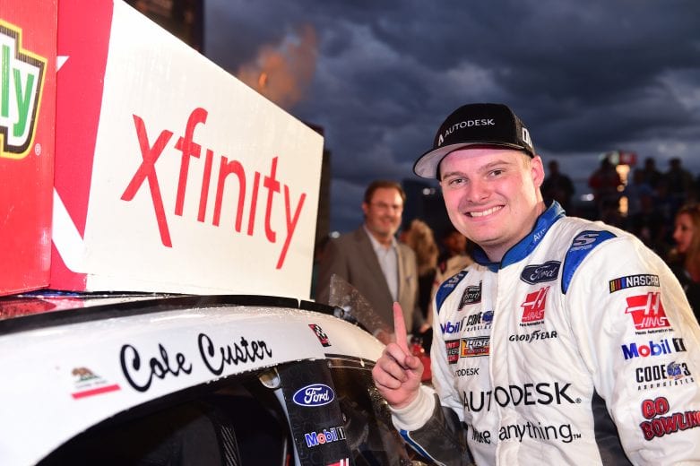 FORT WORTH, TX - NOVEMBER 03: Cole Custer, driver of the #00 Autodesk Ford, celebrates by placing the Winner's Sticker on his car after winning the NASCAR Xfinity Series O'Reilly Auto Parts 300 at Texas Motor Speedway on November 3, 2018 in Fort Worth, Texas. (Photo by Jared C. Tilton/Getty Images) | Getty Images