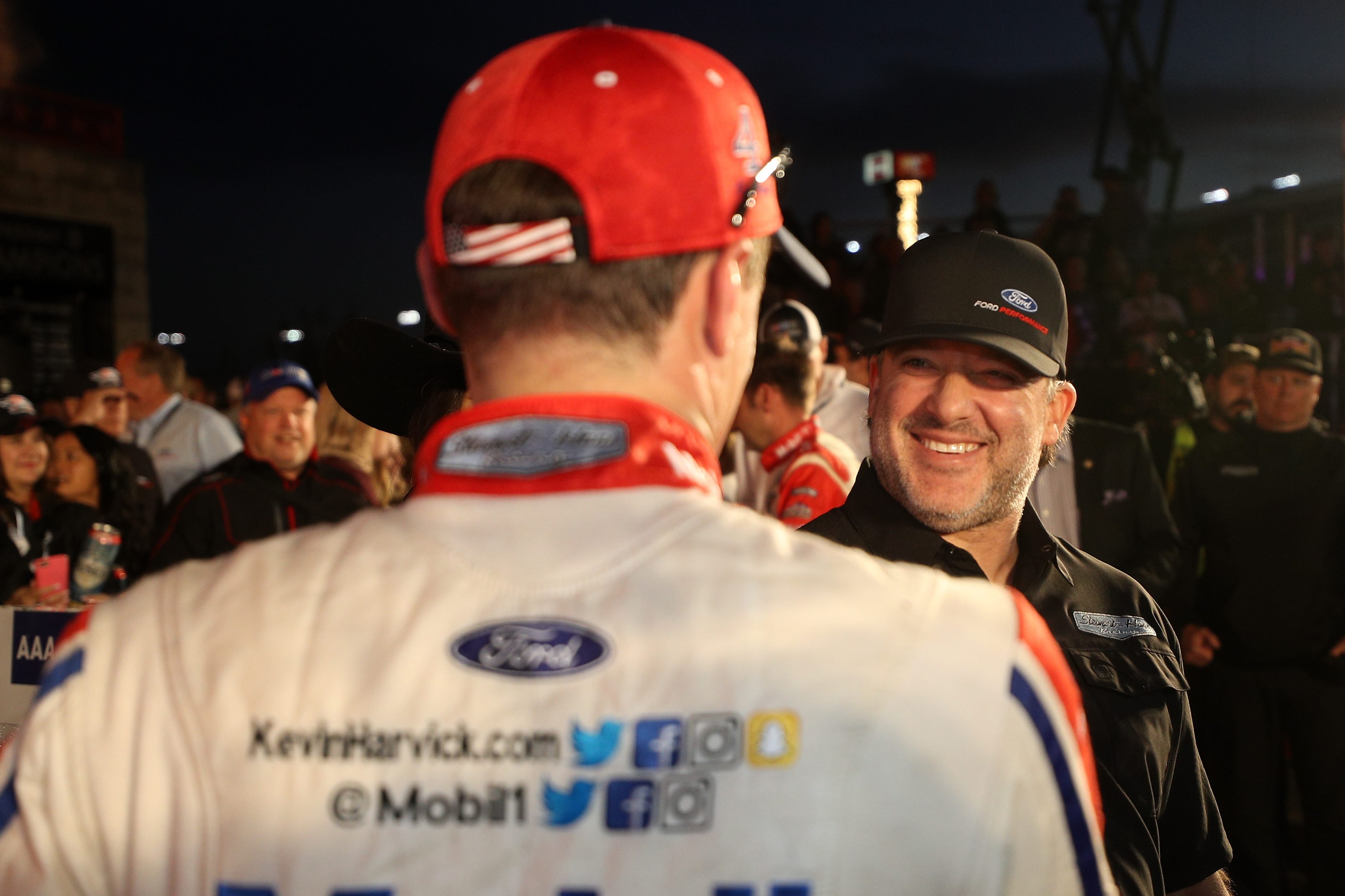 FORT WORTH, TX - NOVEMBER 04:  Kevin Harvick, driver of the #4 Mobil 1 Ford, and team owner Tony Stewart celebrate in Victory Lane after winning the Monster Energy NASCAR Cup Series AAA Texas 500 at Texas Motor Speedway on November 4, 2018 in Fort Worth, Texas.  (Photo by Chris Graythen/Getty Images) | Getty Images