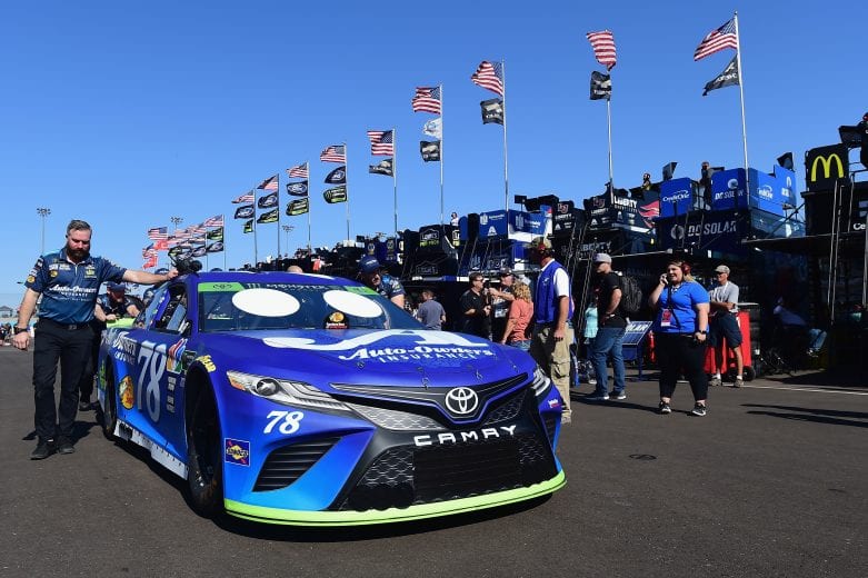 PHOENIX, AZ - NOVEMBER 09:  Crew members push the #78 Auto-Owners Insurance Toyota, driven by Martin Truex Jr.(not pictured), through the garage area during practice for the Monster Energy NASCAR Cup Series Can-Am 500 at ISM Raceway on November 9, 2018 in Phoenix, Arizona.  (Photo by Jared C. Tilton/Getty Images) | Getty Images