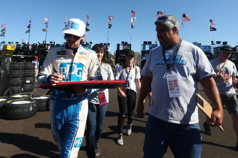 PHOENIX, AZ - NOVEMBER 09:  Ryan Blaney, driver of the #12 PPG Ford, signs autographs during practice for the Monster Energy NASCAR Cup Series Can-Am 500 at ISM Raceway on November 9, 2018 in Phoenix, Arizona.  (Photo by Sarah Crabill/Getty Images) | Getty Images
