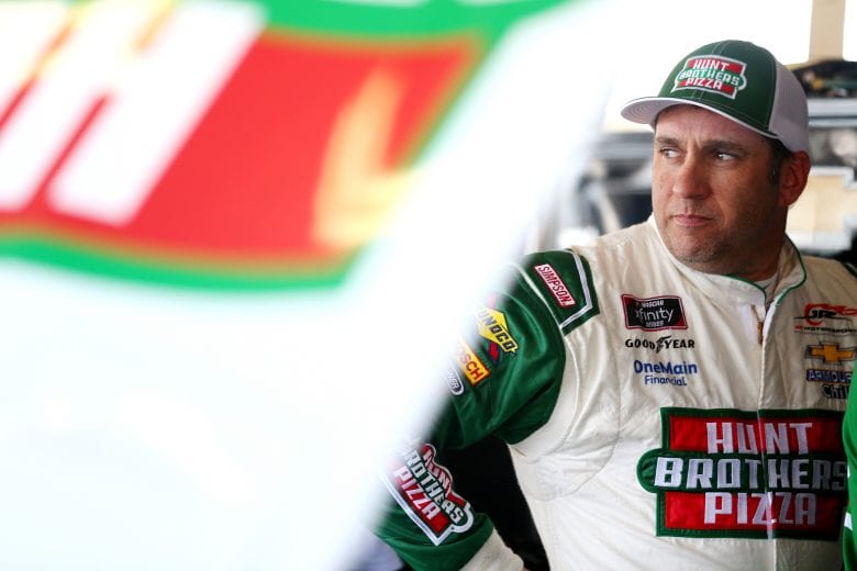 PHOENIX, AZ - NOVEMBER 09:  Elliott Sadler, driver of the #1 Hunt Brothers Pizza Chevrolet, stands in the garage area during practice for the NASCAR Xfinity Series Whelen Trusted To Perform 200 at ISM Raceway on November 9, 2018 in Phoenix, Arizona.  (Photo by Sarah Crabill/Getty Images) | Getty Images