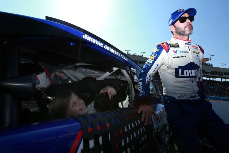 PHOENIX, AZ - NOVEMBER 11:  Jimmie Johnson, driver of the #48 Lowe's Power of Pride Chevrolet, looks on as his daughter Genevieve sits in his car prior to the Monster Energy NASCAR Cup Series Can-Am 500 at ISM Raceway on November 11, 2018 in Phoenix, Arizona.  (Photo by Sean Gardner/Getty Images) | Getty Images