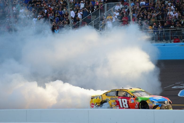 PHOENIX, AZ - NOVEMBER 11:  Kyle Busch, driver of the #18 M&M's Toyota, celebrates with a burnout after winning the Monster Energy NASCAR Cup Series Can-Am 500 at ISM Raceway on November 11, 2018 in Phoenix, Arizona.  (Photo by Jared C. Tilton/Getty Images) | Getty Images