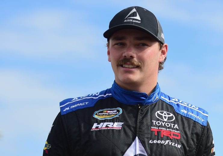 HOMESTEAD, FL - NOVEMBER 16:  Brett Moffitt, driver of the #16 AISIN Group Toyota, stands in the garage area during practice for the NASCAR Camping World Truck Series Ford EcoBoost 200 at Homestead-Miami Speedway on November 16, 2018 in Homestead, Florida.  (Photo by Jared C. Tilton/Getty Images) | Getty Images