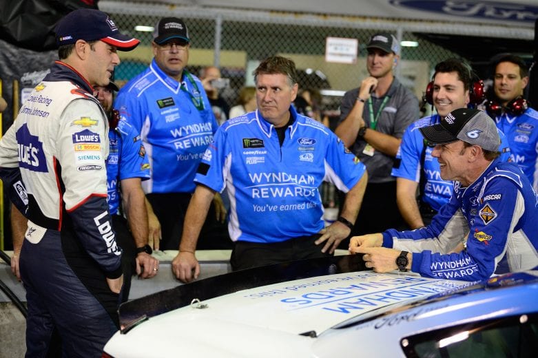HOMESTEAD, FL - NOVEMBER 16:  Jimmie Johnson, driver of the #48 Lowe's Rookie Throwback Chevrolet, talks to Matt Kenseth, driver of the #6 Wyndham Rewards Ford, during qualifying for the Monster Energy NASCAR Cup Series Ford EcoBoost 400 at Homestead-Miami Speedway on November 16, 2018 in Homestead, Florida.  (Photo by Robert Laberge/Getty Images) | Getty Images