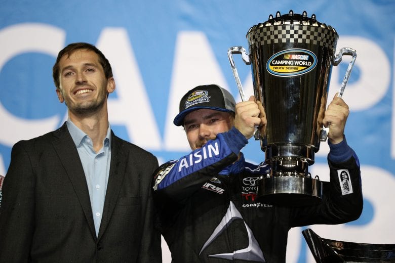 HOMESTEAD, FL - NOVEMBER 16:  Brett Moffitt, driver of the #16 AISIN Group Toyota, celebrates in victory lane with the trophy after winning the NASCAR Camping World Truck Series Ford EcoBoost 200 and the NASCAR Camping World Truck Series Championship at Homestead-Miami Speedway on November 16, 2018 in Homestead, Florida.  (Photo by Chris Graythen/Getty Images) | Getty Images