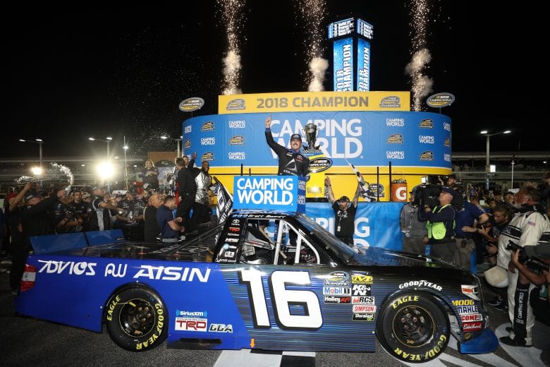 HOMESTEAD, FL - NOVEMBER 16:  Brett Moffitt, driver of the #16 AISIN Group Toyota, celebrates in victory lane with the trophy after winning the NASCAR Camping World Truck Series Ford EcoBoost 200 and the NASCAR Camping World Truck Series Championship at Homestead-Miami Speedway on November 16, 2018 in Homestead, Florida.  (Photo by Chris Graythen/Getty Images) | Getty Images