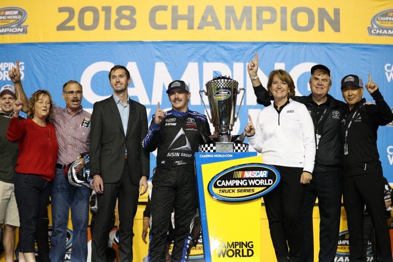 HOMESTEAD, FL - NOVEMBER 16:  Brett Moffitt, driver of the #16 AISIN Group Toyota, celebrates in victory lane with the trophy after winning the NASCAR Camping World Truck Series Ford EcoBoost 200 and the NASCAR Camping World Truck Series Championship at Homestead-Miami Speedway on November 16, 2018 in Homestead, Florida.  (Photo by Chris Graythen/Getty Images) | Getty Images