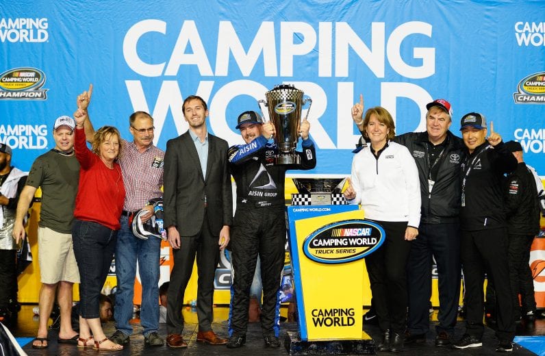 HOMESTEAD, FL - NOVEMBER 16:  Brett Moffitt, driver of the #16 AISIN Group Toyota, celebrates in victory lane with the trophy after winning the NASCAR Camping World Truck Series Ford EcoBoost 200 and the NASCAR Camping World Truck Series Championship at Homestead-Miami Speedway on November 16, 2018 in Homestead, Florida.  (Photo by Robert Laberge/Getty Images) | Getty Images