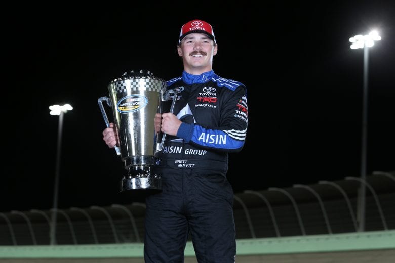 HOMESTEAD, FL - NOVEMBER 16:  Brett Moffitt, driver of the #16 AISIN Group Toyota, poses for a photo after winning the NASCAR Camping World Truck Series Championship at Homestead-Miami Speedway on November 16, 2018 in Homestead, Florida.  (Photo by Brian Lawdermilk/Getty Images) | Getty Images