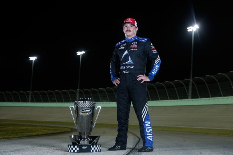 HOMESTEAD, FL - NOVEMBER 16:  Brett Moffitt, driver of the #16 AISIN Group Toyota, poses for a photo after winning the NASCAR Camping World Truck Series Championship at Homestead-Miami Speedway on November 16, 2018 in Homestead, Florida.  (Photo by Brian Lawdermilk/Getty Images) | Getty Images