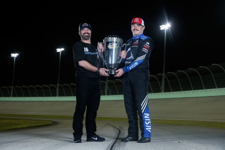 HOMESTEAD, FL - NOVEMBER 16:  Brett Moffitt, driver of the #16 AISIN Group Toyota, and crew chief Scott Zipadelli pose for a photo after winning the NASCAR Camping World Truck Series Championship at Homestead-Miami Speedway on November 16, 2018 in Homestead, Florida.  (Photo by Brian Lawdermilk/Getty Images) | Getty Images