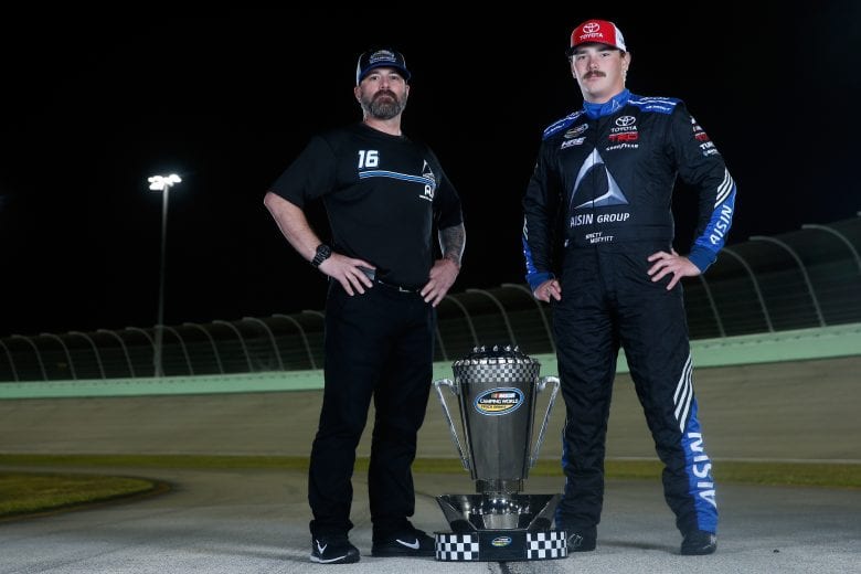 HOMESTEAD, FL - NOVEMBER 16:  Brett Moffitt, driver of the #16 AISIN Group Toyota, and crew chief Scott Zipadelli pose for a photo after winning the NASCAR Camping World Truck Series Championship at Homestead-Miami Speedway on November 16, 2018 in Homestead, Florida.  (Photo by Brian Lawdermilk/Getty Images) | Getty Images