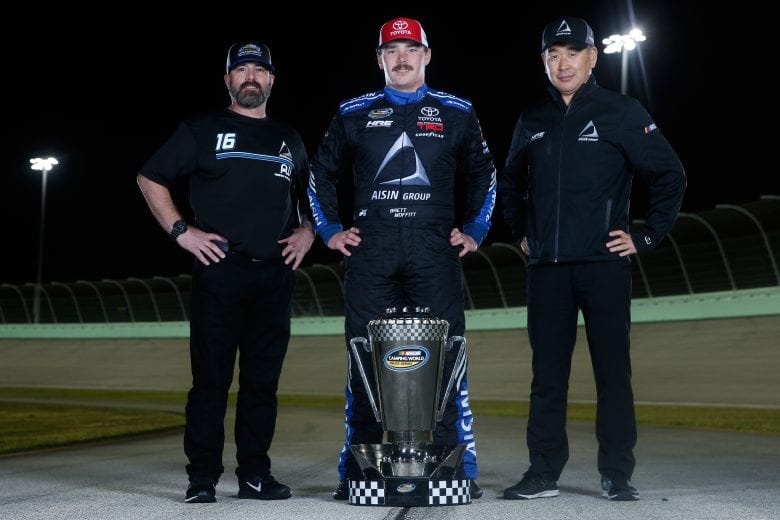 HOMESTEAD, FL - NOVEMBER 16:  Brett Moffitt, driver of the #16 AISIN Group Toyota, crew chief Scott Zipadelli and team owner Shigeaki Hattori pose for a photo after winning the NASCAR Camping World Truck Series Championship at Homestead-Miami Speedway on November 16, 2018 in Homestead, Florida.  (Photo by Brian Lawdermilk/Getty Images) | Getty Images