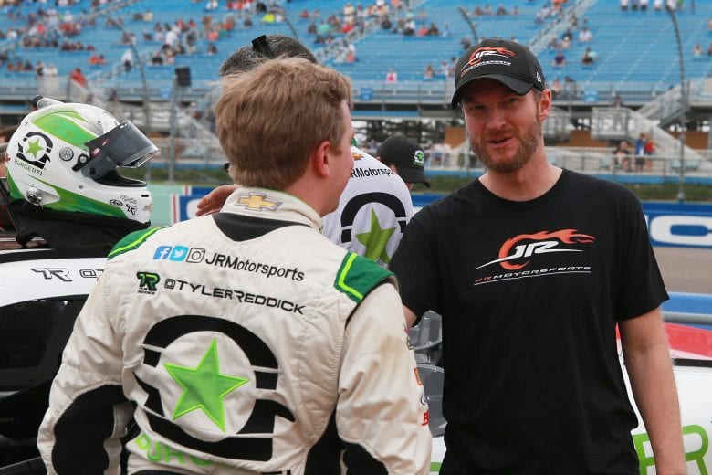HOMESTEAD, FL - NOVEMBER 17:  Tyler Reddick, driver of the #9 BurgerFi Chevrolet, talks with Dale Earnhardt Jr. piror to the NASCAR Xfinity Series Ford EcoBoost 300 at Homestead-Miami Speedway on November 17, 2018 in Homestead, Florida.  (Photo by Matt Sullivan/Getty Images) | Getty Images