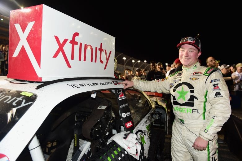 HOMESTEAD, FL - NOVEMBER 17:  Tyler Reddick, driver of the #9 BurgerFi Chevrolet, poses with the winner's sticker in Victory Lane after the NASCAR Xfinity Series Ford EcoBoost 300 at Homestead-Miami Speedway on November 17, 2018 in Homestead, Florida.  (Photo by Jared C. Tilton/Getty Images) | Getty Images