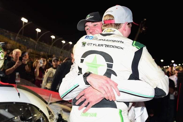 HOMESTEAD, FL - NOVEMBER 17:  Tyler Reddick, driver of the #9 BurgerFi Chevrolet, gets a hug from Austin Cindric, driver of the #22 MoneyLion Ford, in Victory Lane after winning the NASCAR Xfinity Series Ford EcoBoost 300 at Homestead-Miami Speedway on November 17, 2018 in Homestead, Florida.  (Photo by Jared C. Tilton/Getty Images) | Getty Images