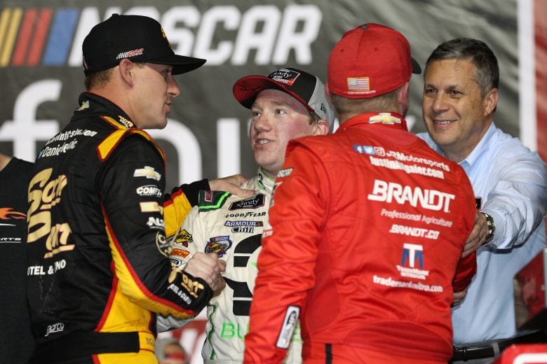 HOMESTEAD, FL - NOVEMBER 17:  Tyler Reddick, driver of the #9 BurgerFi Chevrolet, is congratulated by Daniel Hemric, driver of the #21 South Point Hotel & Casino Chevrolet, and Justin Allgaier, driver of the #7 BRANDT Professional Agriculture Chevrolet, after winning the NASCAR Xfinity Series Ford EcoBoost 300 at Homestead-Miami Speedway on November 17, 2018 in Homestead, Florida.  (Photo by Chris Graythen/Getty Images) | Getty Images